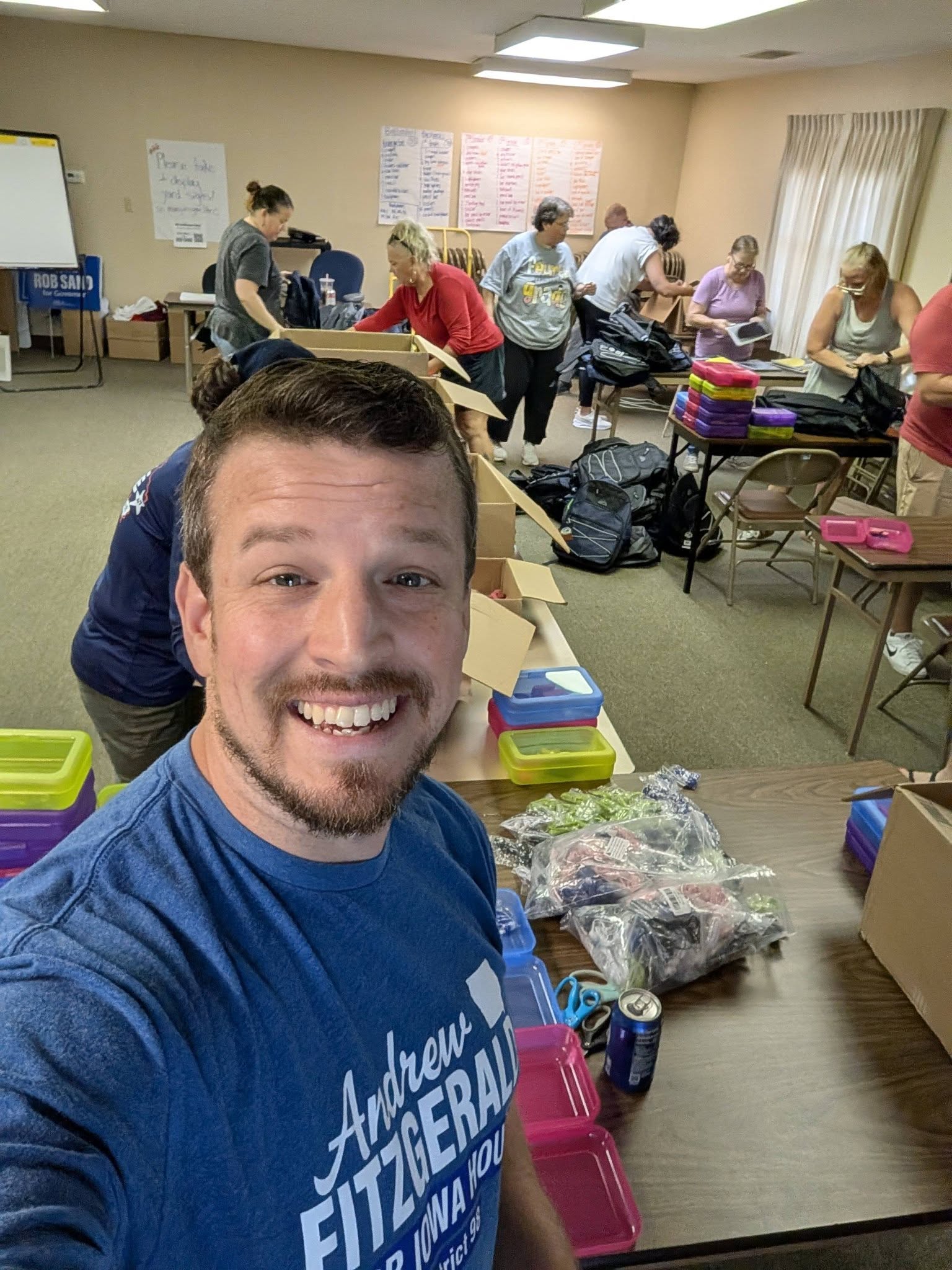 Andrew Fitzgerald volunteering with neighbors to pack school supply backpacks
