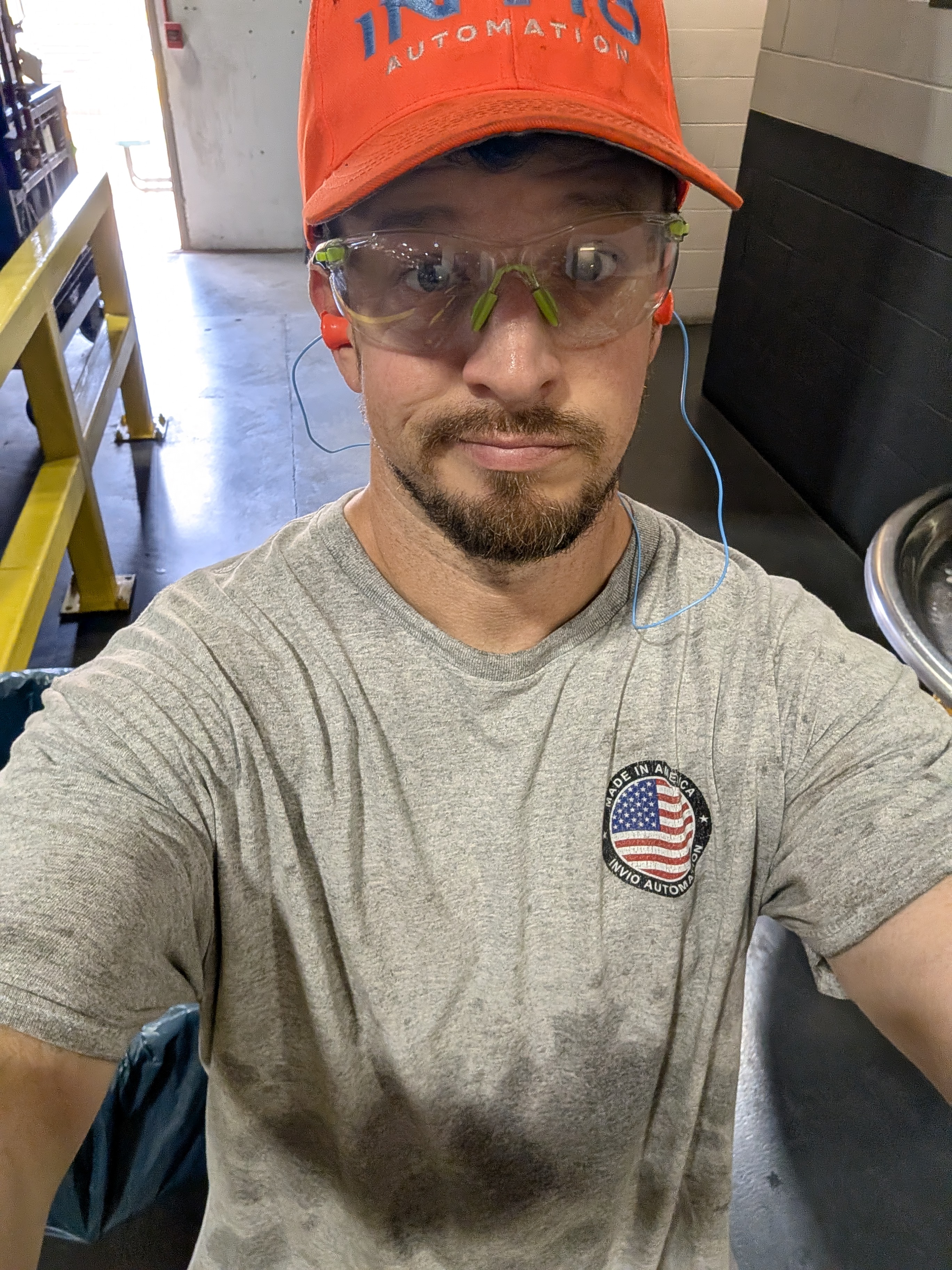Andrew Fitzgerald at work wearing safety gear and a Made in America union shirt